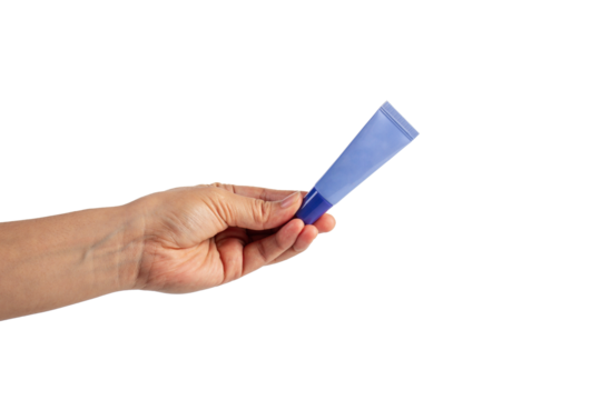 Purple packaging for cream, sunscreen or serum in hand on transparent background.