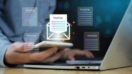 E-Invoice and Digital billing concept, Businessman using laptop to manage electronic statements on virtual screen. E-tax, Digital receipt, Online invoice processing and tax accounting solutions.