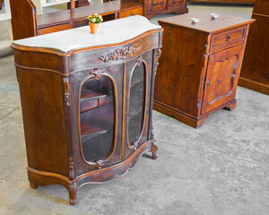 DETAIL OF AN ANTIQUE WOODEN ITALIAN FURNITURE just restored with floral decorations