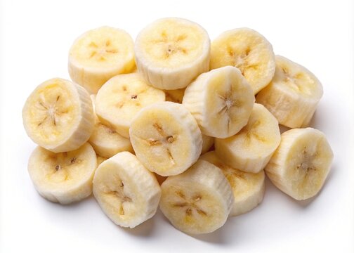 Closeup of a pile of freshly sliced bananas on a white surface