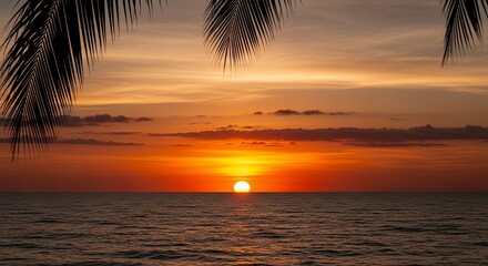 Serene Sunset Over Ocean with Palm Leaves