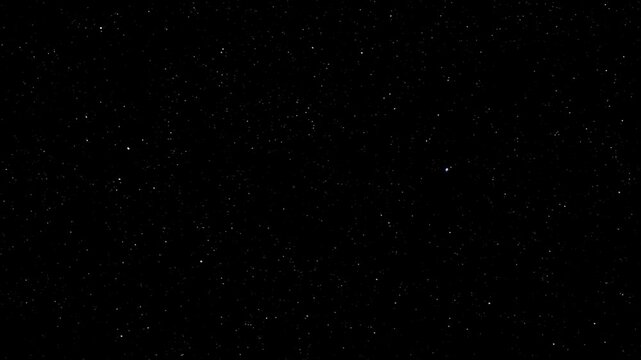 Distant pinpricks of starlight scatter across the inky void of deep space creating a serene cosmic vista