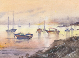 Yachts on lake in sunset