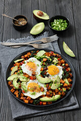 fried sweet potato cubes, eggs, and fresh avocado