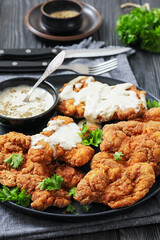 Deep fried Southern chicken thighs with milk gravy