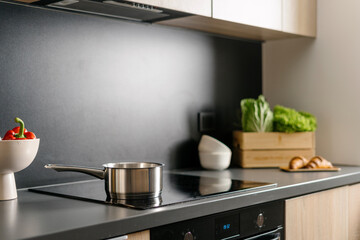 Modern kitchen interior featuring sleek design and fresh ingredients for cooking