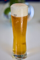 a glass of freshly poured beer
