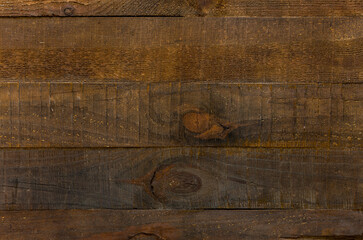 Brown grunge background. Texture of uncouth  natural wooden surface. Rough wooden planks with...