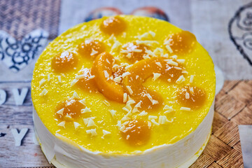 a fresh cake with peaches and custard