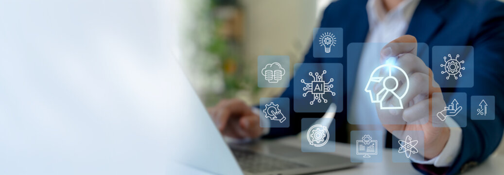 Human-AI collaboration concept. Businessman interface digital icon of a human-AI hybrid head, synergy between human intelligence and artificial intelligence  in modern technology and innovation. - Powered by Adobe