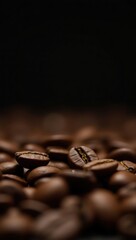 Roasted coffee beans close up dark background