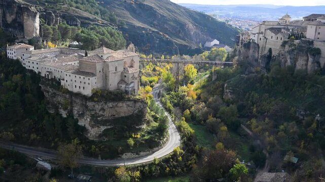Two of the most famous landmarks in Cuenca, Spain, the Parador hotel and the Hanging Houses, face each other across the dramatic cliffside of the gorge.