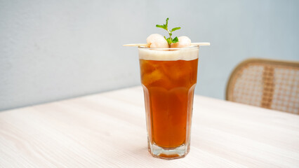 Lychee iced tea with mint leaves
