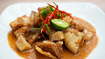 Batagor, made from fish or chicken dumpling, tofu, tapioca flour served with peanut sauce. Indonesian food
