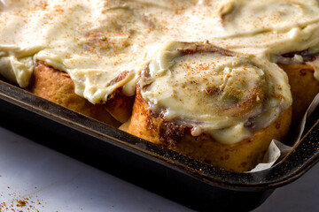 Homemade cinnabons with cinnamon and cream cheese.