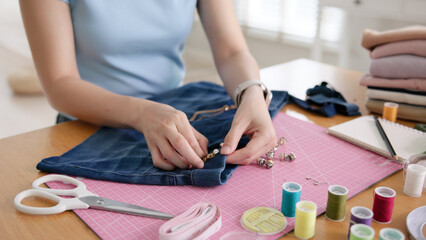 Asia people go green woman make craft DIY skill eco second hand denim jeans idea reuse old used unused fabric net zero waste fast fashion cotton issue. Home design in asian hobby thrift retail owner.