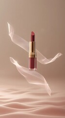 Image of lipstick tube floating above soft mist surrounded by silky thin veils of ribbons, product presentation.