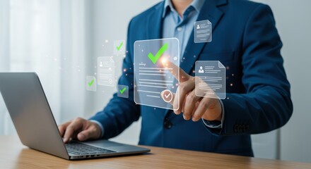 A businessman in a blue suit uses a laptop to review and approve digital documents, each marked with a green checkmark, in a modern office setting