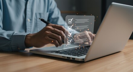 Focused hands check off items on a glowing digital checklist projected onto a laptop screen, completing tasks in a dimly lit workspace