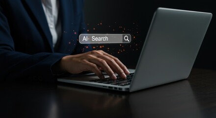 Person typing on a laptop with an ai search bar displayed on the screen