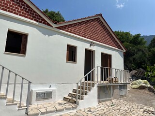 Traditional House with Red Brick Gables and Stone Entrance Steps