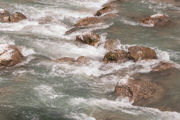 River steam Inn with rocks nature between mountains in Tyrol Austria.