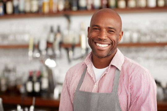 joyful bartender smiling positioned on right side of frame - Powered by Adobe