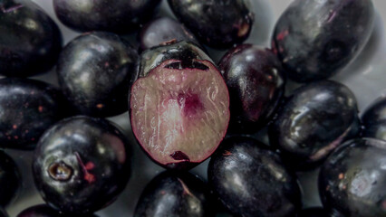 Black jamun java plums on the table