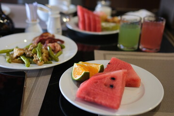 fresh fruit, including vibrant watermelon slices and a variety of ripe fruits in a bowl, promoting healthy eating. High quality photo