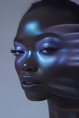 Close-up of a black woman's face with metallic blue eye makeup with blur effect.