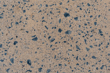 Close-up of concrete paving featuring blue stone texture