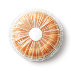 Overhead shot of a cheesecake, sealed in plastic with a white label on a white background