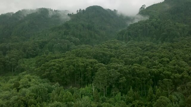 Aerial slow and mysterious Shot flying into the mountain range of Bogota