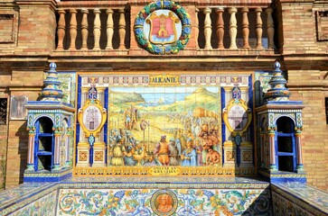 Seville, Spain 03.23.2019: Colorful tiled alcove dedicated to the city of Alicante with medieval...