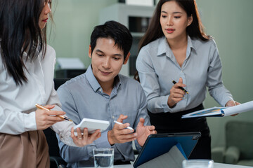 Business team present. professional investor working new start up project. Finance managers meeting.using smart phone and laptop and digital tablet computer in modern office.
