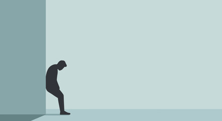 Obraz premium Person sitting against wall feeling dejected