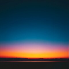 Serene twilight sky showcasing a gradient of vibrant colors over a calm horizon at sunset