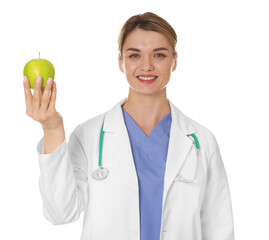 Nutritionist with green apple and stethoscope on white background