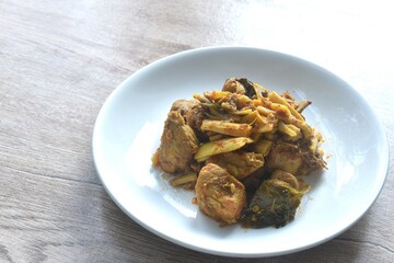 spicy stir fried bamboo shoot and chicken with curry on plate