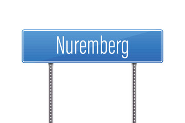 A blue road sign indicates the direction of Nuremberg, presented against a clear white backdrop, showcasing a simple and informative design element on a sunny day. 