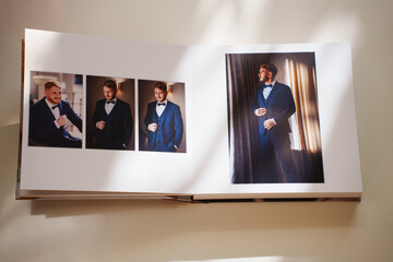  an open photo book with wedding photos on a white table