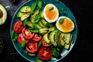 Healthy Breakfast with Avocado, Egg, and Tomato on a Plate
