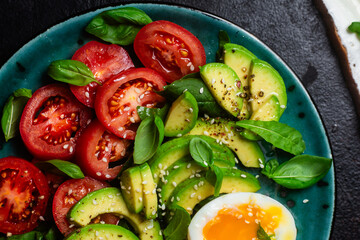 Healthy Breakfast with Avocado, Egg, and Tomato on a Plate