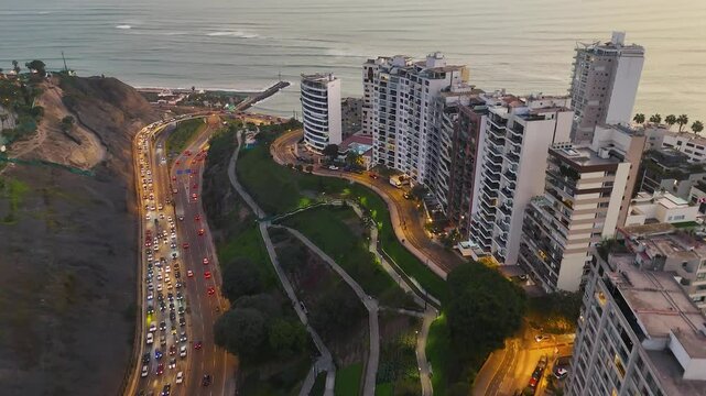 Coastal Highway Curves Through Miraflores Cliffs During Sunset in Lima, Peru