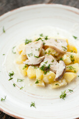 Potatoes with porcini mushrooms and dill on a plate