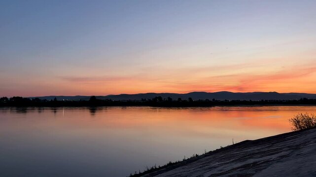 sunset over the river. riverbank embankment