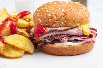 roast beef sandwich top wit ketch up and mustard