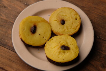 Kue lumpur is a snack with the main ingredients of coconut milk, potatoes, wheat flour, and eggs....