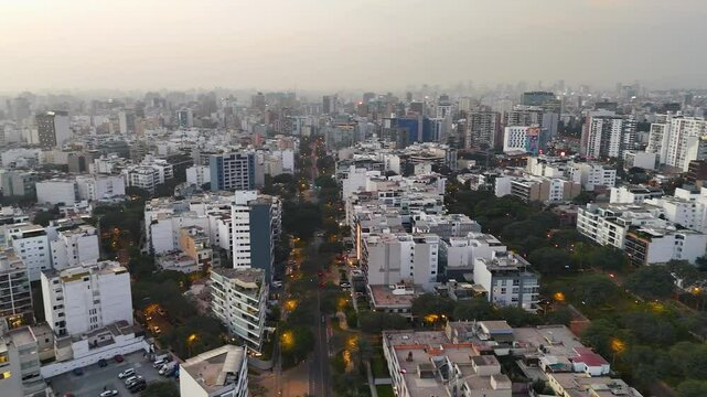 Aerial Sunrise Flyover of Tree-Lined Residential Grid in Miraflores, Lima, Peru