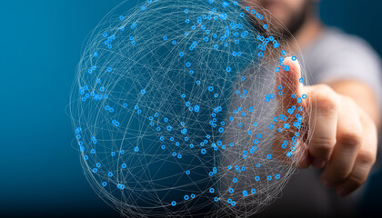 Hand interacting with a digital globe, representing global network, connection, and technology.